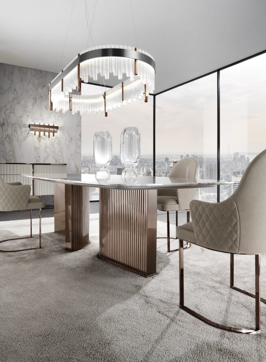 Tiffany стол | DV home. Изысканный обеденный стол с роскошной мраморной столешницей и выразительным изогнутым основанием из нержавеющей стали, воплощающий элегантность ар-деко.